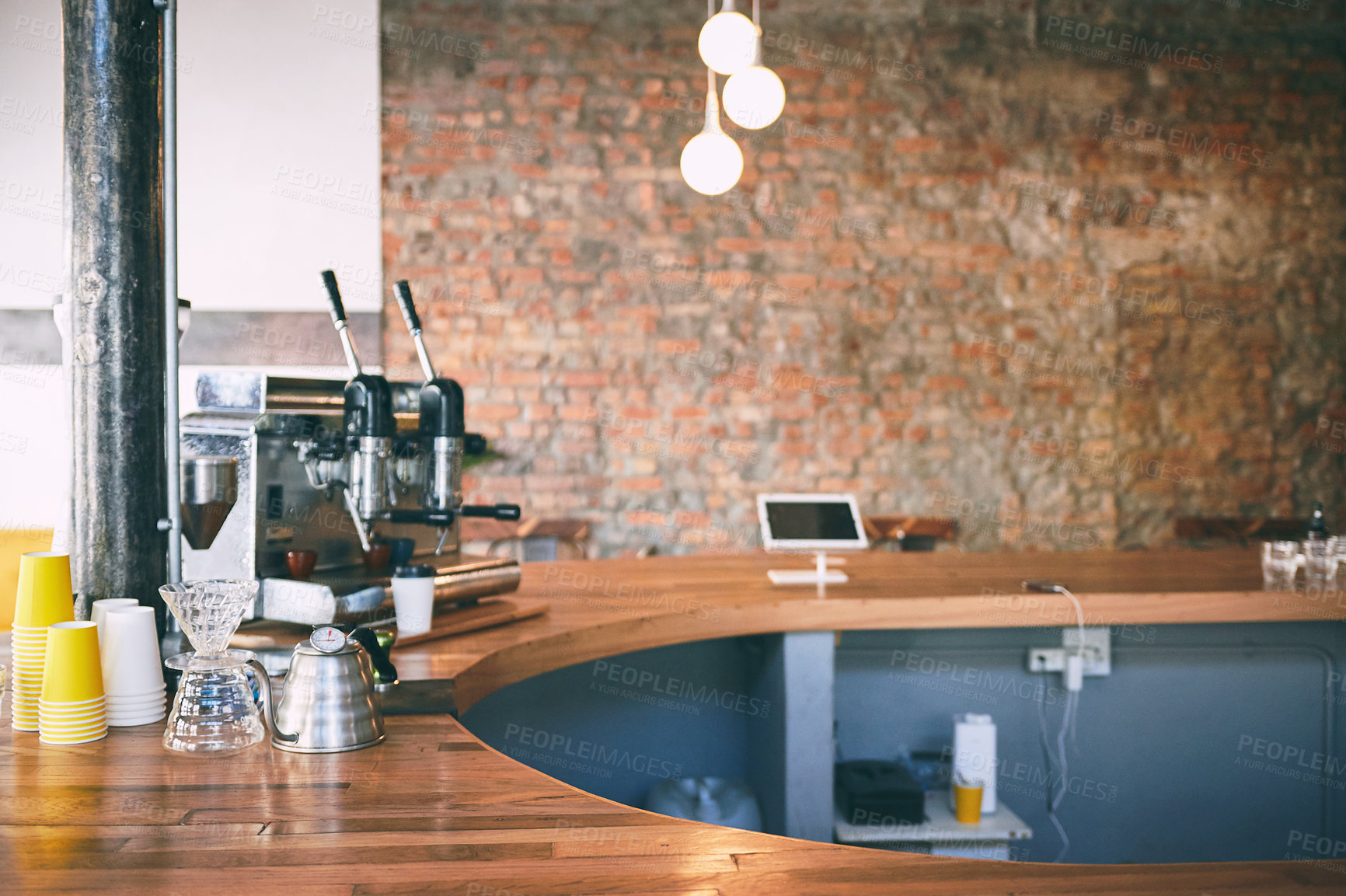 Buy stock photo Shot of a coffee maker on a counter in an empty cafe
