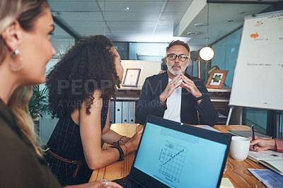 Buy stock photo Shot of a group of businesspeople having a meeting in the boardroom of a modern office