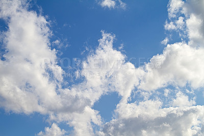 Buy stock photo Beautiful, calm and peaceful view of blue sky with stratocumulus clouds and copy space from below. Low angle scenery of white, fluffy and soft cloudscape with heaven theory before forming rainclouds