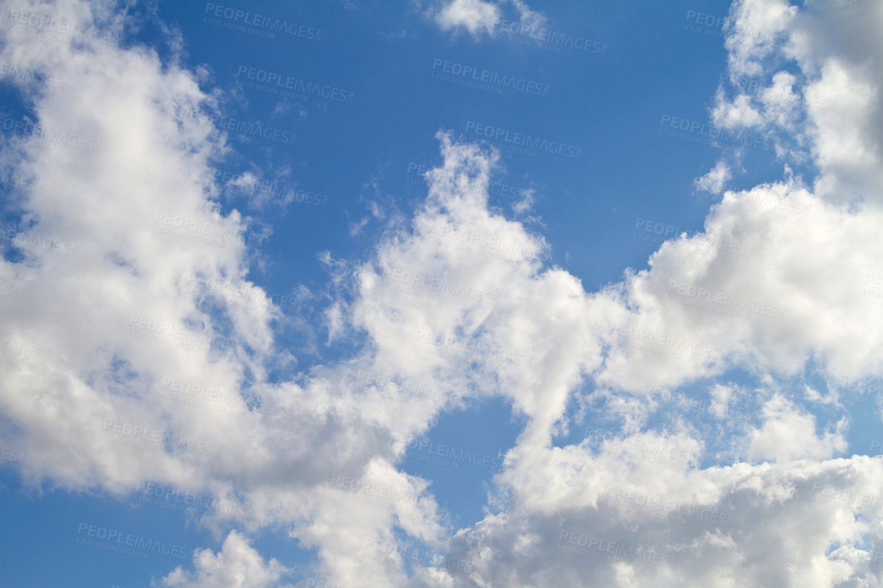 Buy stock photo Beautiful, calm and peaceful view of blue sky with stratocumulus clouds and copy space from below. Low angle scenery of white, fluffy and soft cloudscape with heaven theory before forming rainclouds