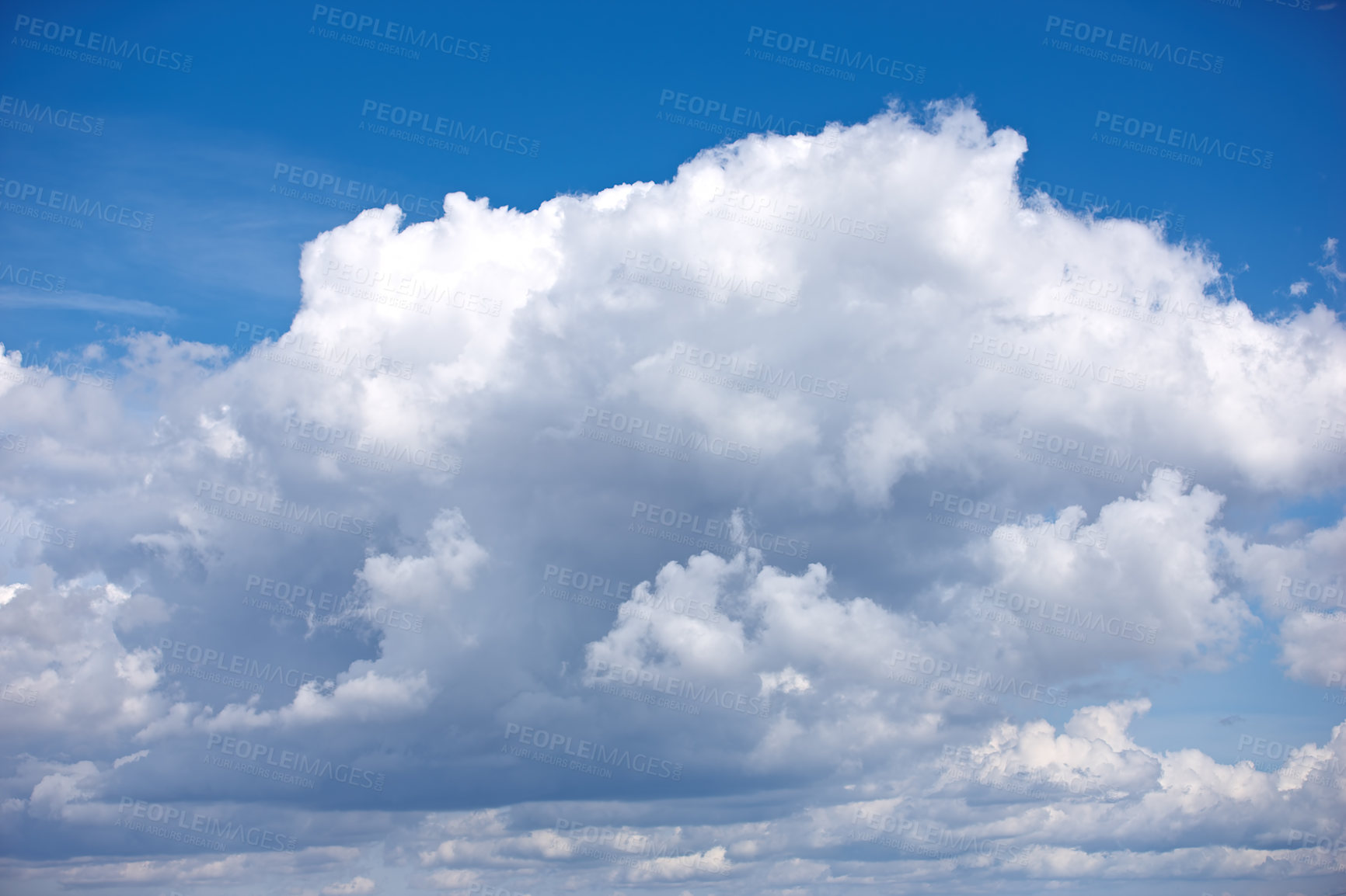 Buy stock photo Panoramic cloudscape view of a fluffy cumulus in a blue sky in summer with copy space. High scenic and copy space views of a cloudy atmosphere and climate in a natural environment during the day