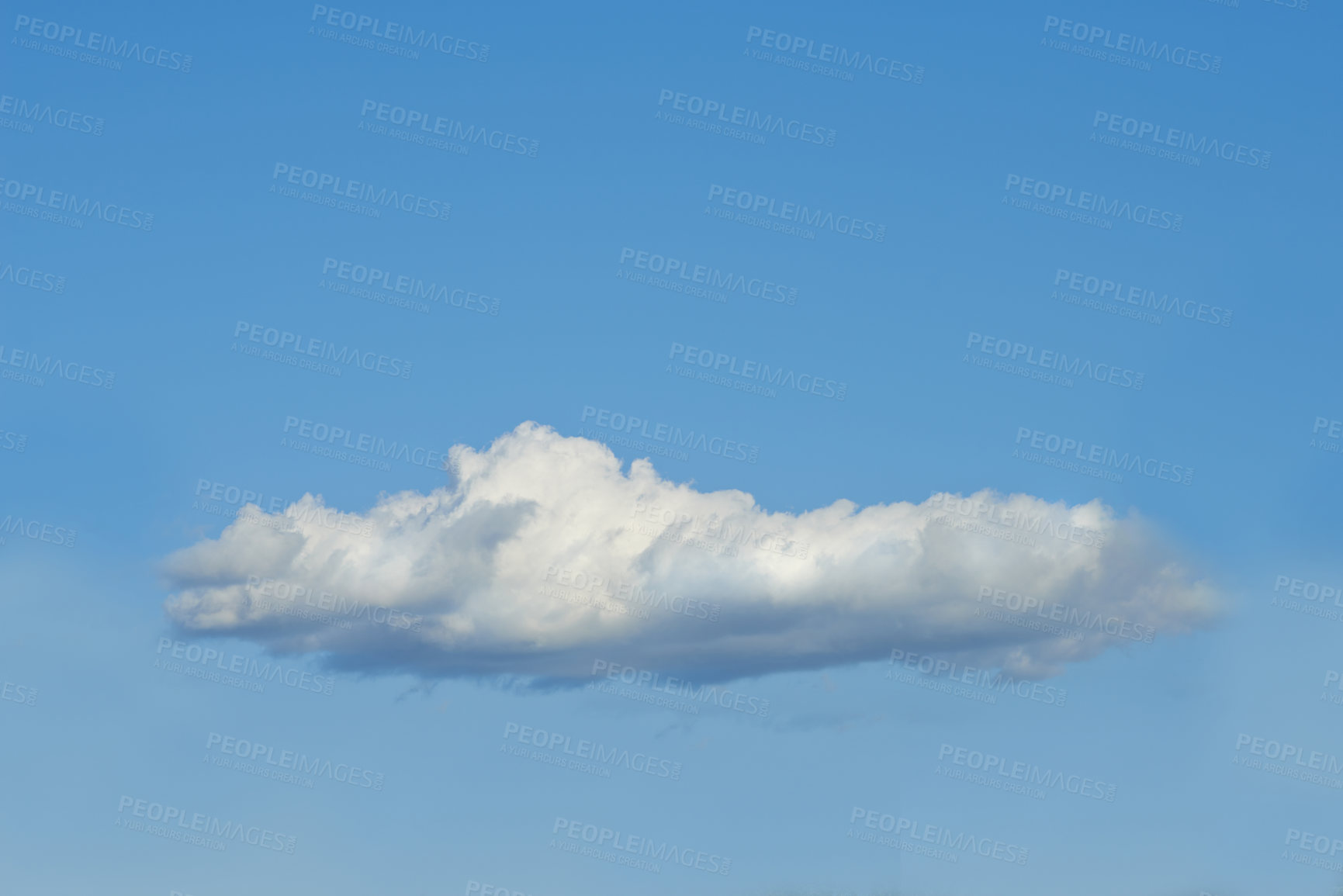 Buy stock photo Copy space with a cloud isolated against a clear blue sky on a sunny day outside. One single fluffy and white cloud floating in a peaceful landscape wallpaper and quiet scene for nature background