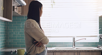 Buy stock photo Thinking, fear and woman in a kitchen with phone waiting for text, notification or call in her home. Contemplation, depression and female in her apartment lonely, anxiety and stress, phobia or crisis