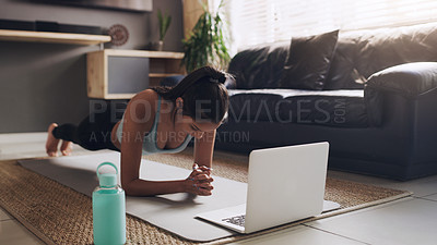Buy stock photo Plank, pilates and woman with laptop on a floor for exercise, fitness and training in a living room. Online computer, push up and female person in a lounge for cardio, workout and endurance routine