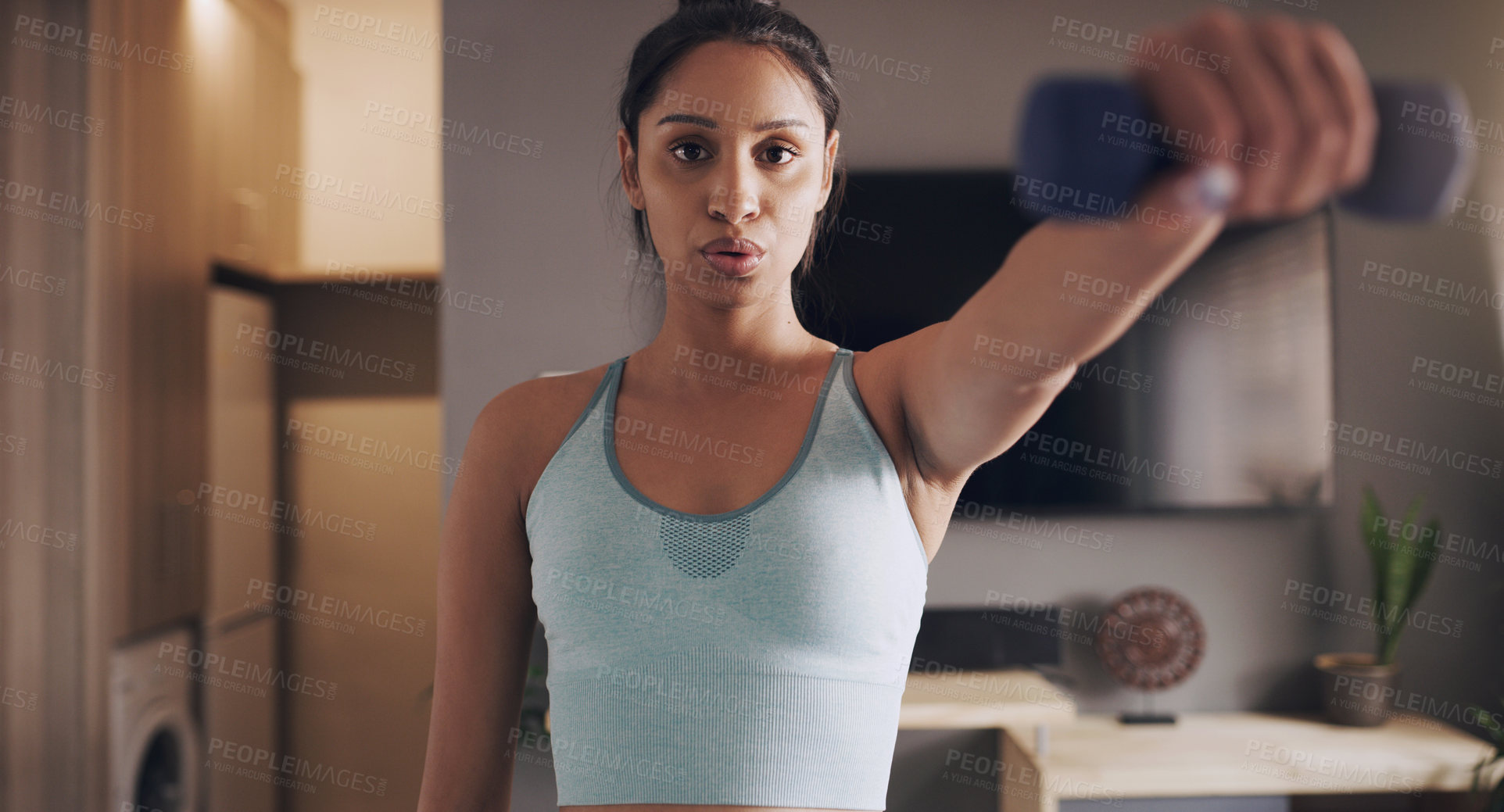 Buy stock photo Home, fitness and Indian woman breathing with dumbbell for exercise, bodybuilding and cardio. Training, arms and female bodybuilder with weights for workout, resilience or challenge in a living room