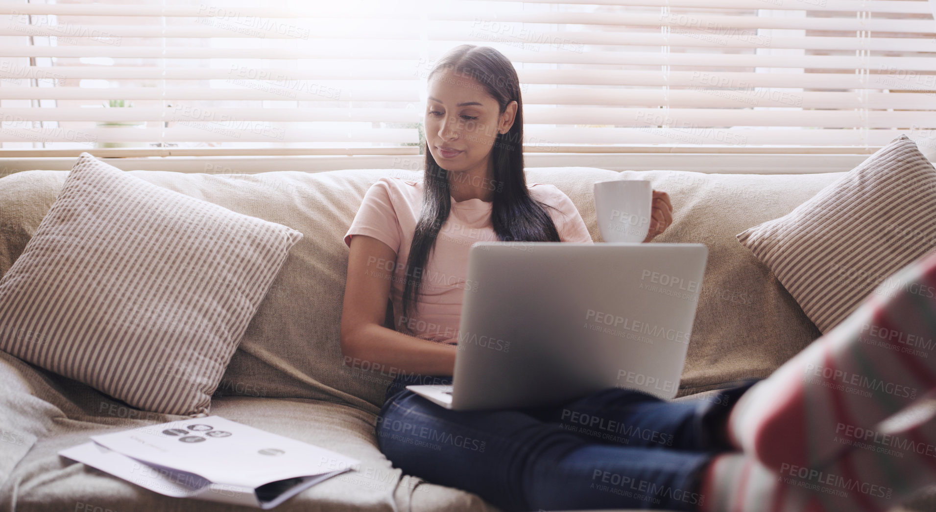 Buy stock photo Sofa, documents and woman with laptop for remote work, relax and coffee for online career. Paperwork, reading and freelancer girl in home with computer for web project, research and drink on couch.