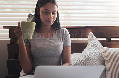 Buy stock photo Bed, coffee and woman with laptop for remote work, relax and research for online career. Thinking, reading and freelancer girl in bedroom with computer checking email, web review and drink in home.