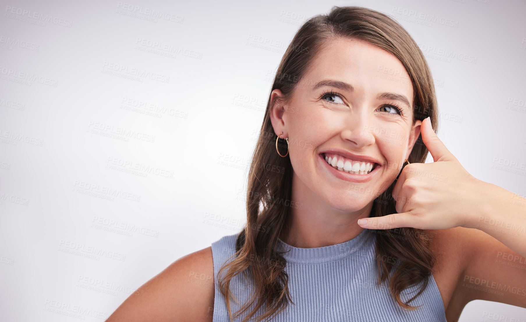 Buy stock photo Woman, face and studio with hand gesture for phone call, contact us and marketing with mockup. Isolated model, smile and emoji for mobile talking by background with advertising, space and connection