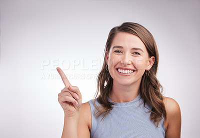 Buy stock photo Pointing, smile and portrait of woman in studio with mockup space for advertising, promotion or marketing. Happy, decision and female person with presentation or choosing gesture by white background.