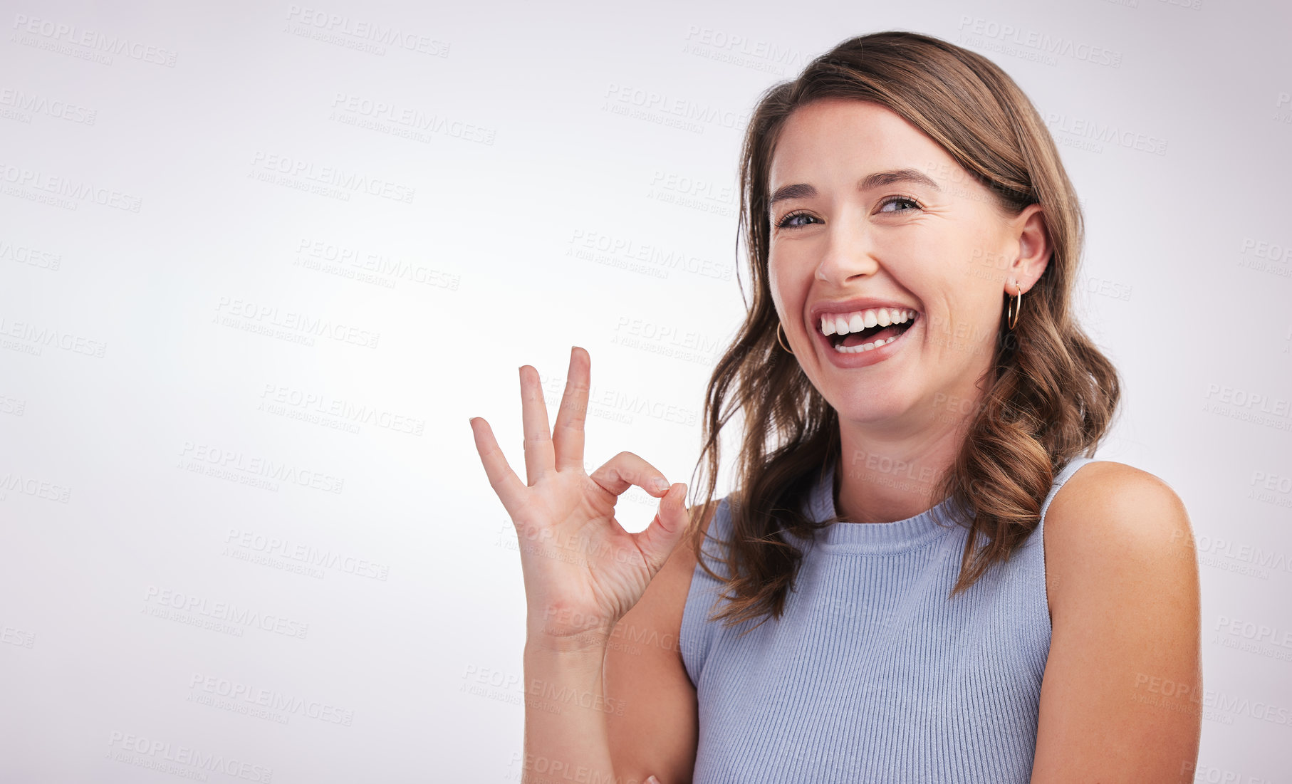 Buy stock photo Okay, agreement and portrait of happy woman in studio mockup with positive attitude. Thank you, smile and girl with ok hand gesture for perfect emoji, yes praise and achievement on white background