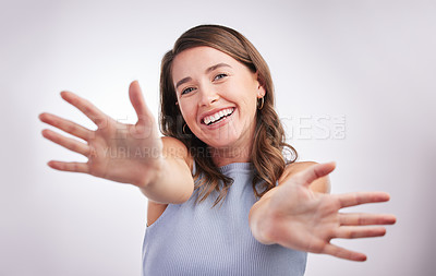 Buy stock photo Hands, portrait and smile with excited woman in studio on gray background for emotion or expression. Emoji, face and gesture with happy person feeling cheerful as winner of bonus or promotion
