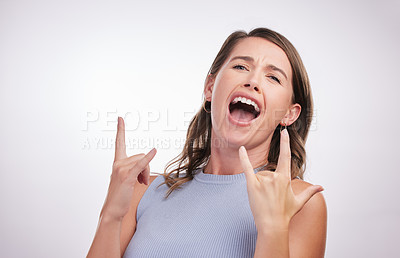 Buy stock photo Rock, hand and gesture with woman for celebration in studio or confidence for success, achievement and freedom of expression. Happy, excited and person with sign for creative heavy metal or music