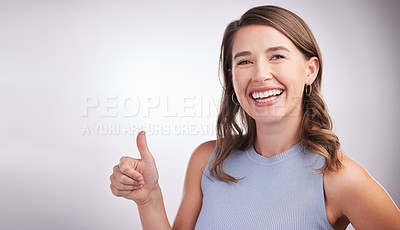 Buy stock photo Thumbs up, vote and portrait of happy woman in studio mockup with positive attitude. Thank you, smile and girl with yes hand gesture for agreement emoji, praise and achievement on white background