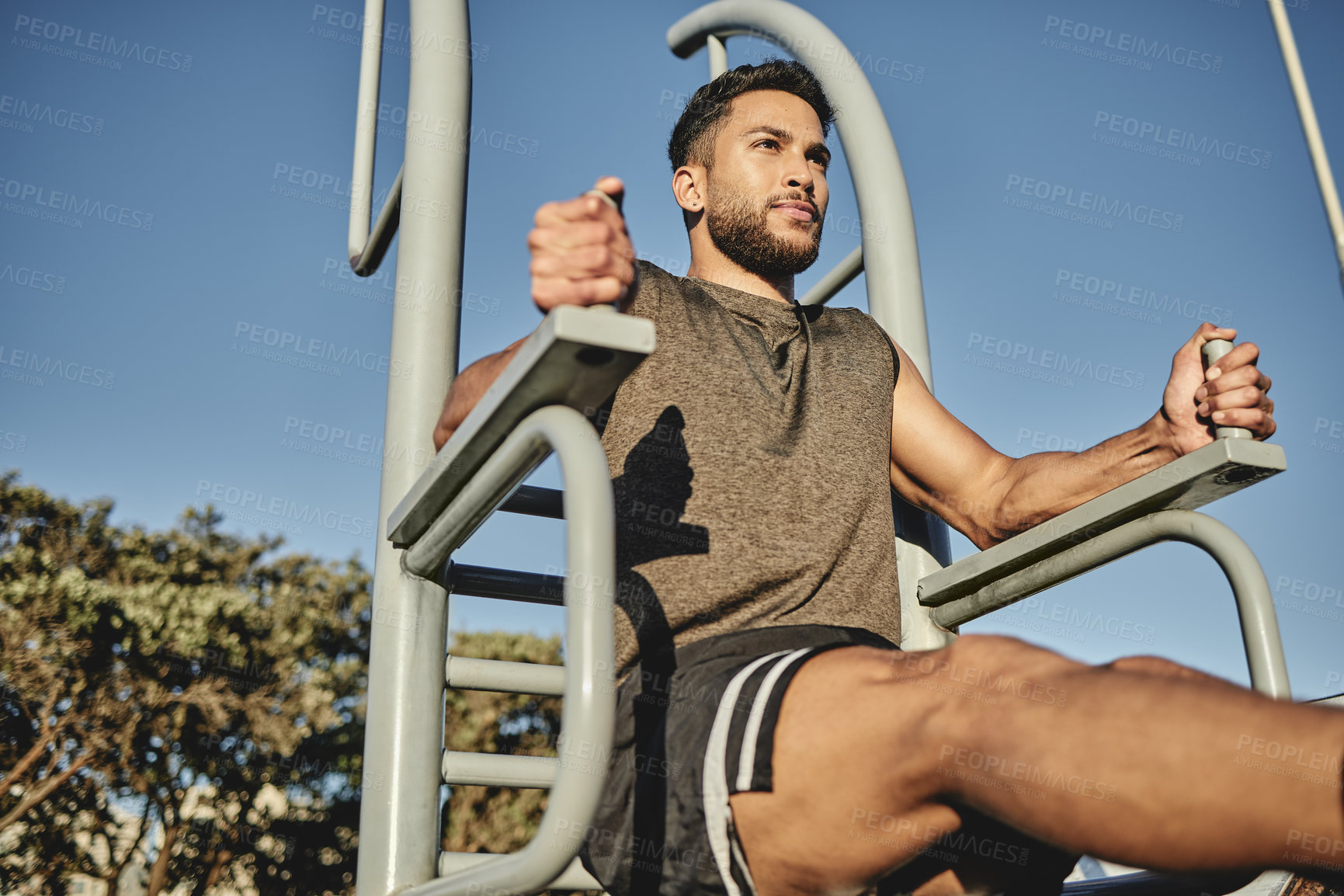 Buy stock photo Leg raises, gym and man for nature exercise, outside and calisthenics for core workout. Blue sky, fitness or abdominal strength for sports and for male person, smile or training in park for wellness