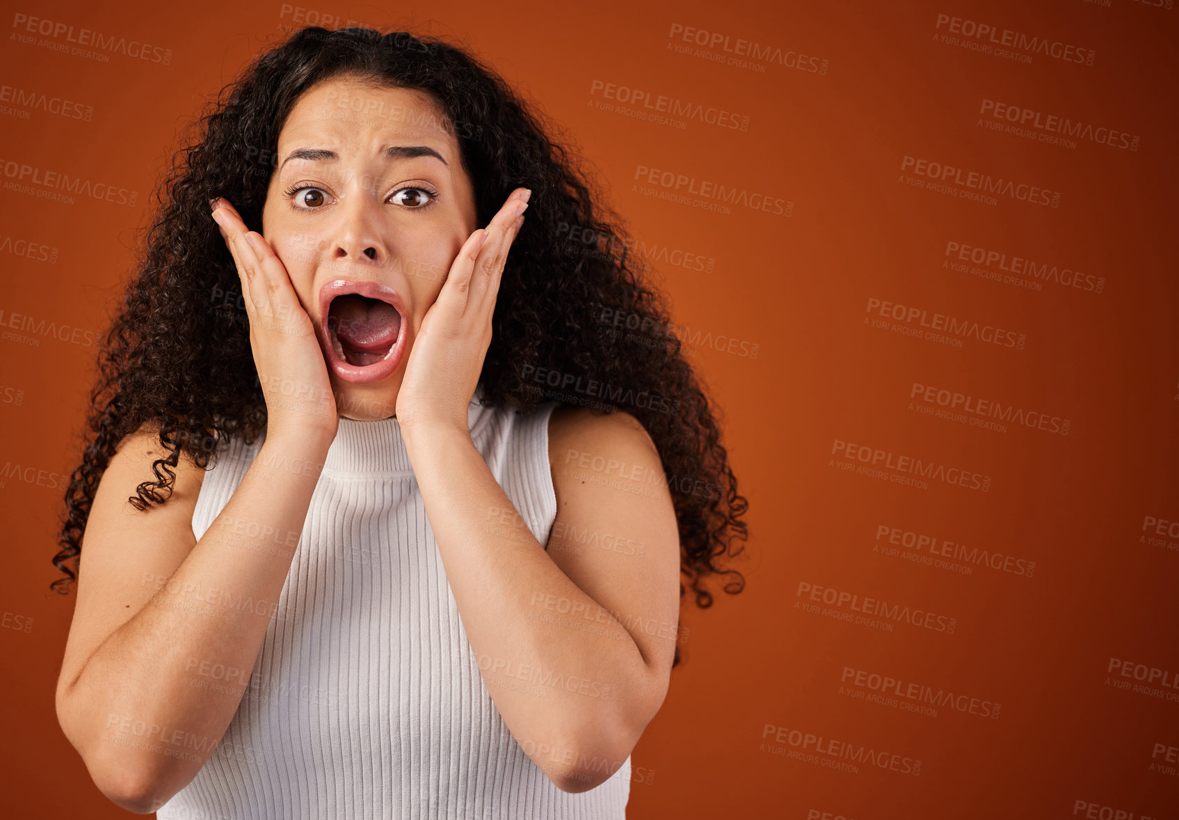 Buy stock photo Woman, portrait and shocked in studio for sad news, announcement and screaming with fear. Brazilian model, wtf and surprised on isolated background with mockup space for secret, gossip and story