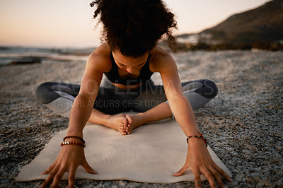 Buy stock photo Full length shot of an attractive young woman practicing yoga on the beach at sunset