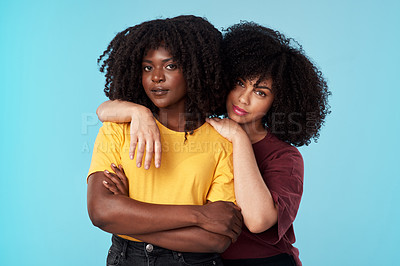 Buy stock photo Portrait, diversity and support with friends on a blue background in studio together for freedom or empowerment.  Love, trust and an attractive young black female standing arms crossed with a friend