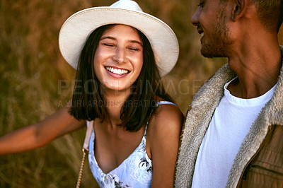 Buy stock photo Couple, love and happy people smiling and travel together enjoying an outdoor date during sunset. Young man and woman on a romantic vacation on a morning walk feeling happiness in summer