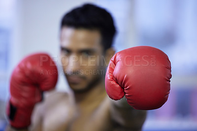 Buy stock photo Fitness, boxing and glove of man closeup for exercise, workout or training for healthy body wellness in gym. Sport, fist and serious athlete in club for fight practice, competition and martial arts