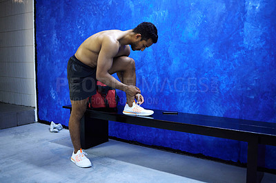 Buy stock photo Man, fitness and tying with shoe at gym in preparation for workout, running or exercise. Active male person on bench to tie laces or getting ready for indoor training in bathroom at health club