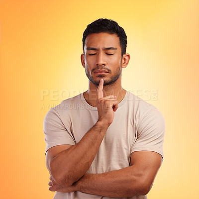 Buy stock photo Thinking, meditate and man in studio to focus, remember memory or decision on yellow background. Face of model person with hand on chin and eyes closed for meditation and to think of ideas and choice