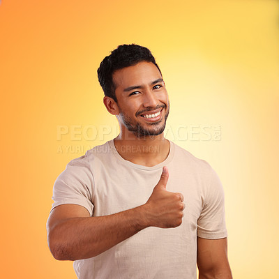 Buy stock photo Hands, thumbs up and portrait of man in studio isolated on a yellow background. Face, fashion and happy male model with hand gesture for like emoji, motivation or success, agreement or thank you.