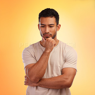 Buy stock photo Thinking, sad and curious Asian man with a decision isolated on a yellow background in a studio. Depression, mental health and depressed Japanese person with a problem, choice or idea on a backdrop