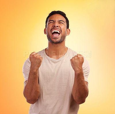Buy stock photo Winner, screaming man and celebration in studio isolated on a yellow background. Winning, wow and happy young male fist pump for celebrating goals, targets achievement or victory, success or lottery.