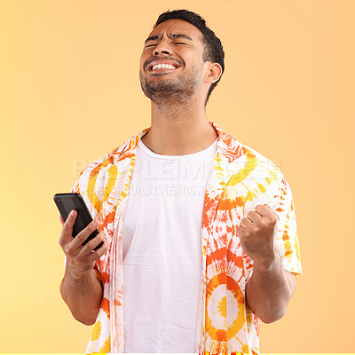 Buy stock photo Winner, celebration and man with phone in studio isolated on yellow background. Winning, cellphone or happy male model holding mobile smartphone while celebrating goals achievement, target or success