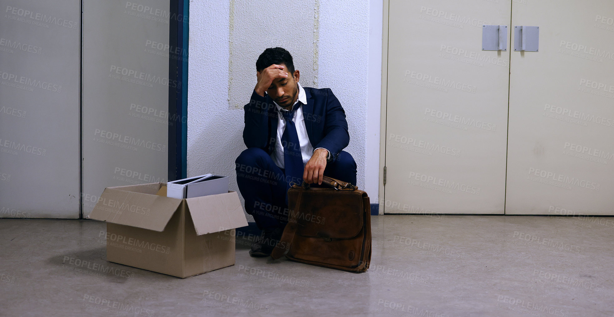 Buy stock photo Businessman, fired and stress with box at workplace with unemployment, failure and disappointment on floor. Professional, employee and helpless in corridor of office building with bag, leaving or sad
