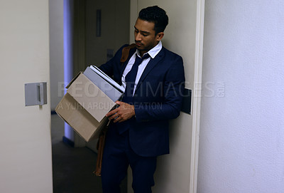 Buy stock photo Businessman, fired and stress with box in office with unemployment, failure and disappointment for leaving. Professional, employee and helpless by door of workplace with bag, frustrated and sad