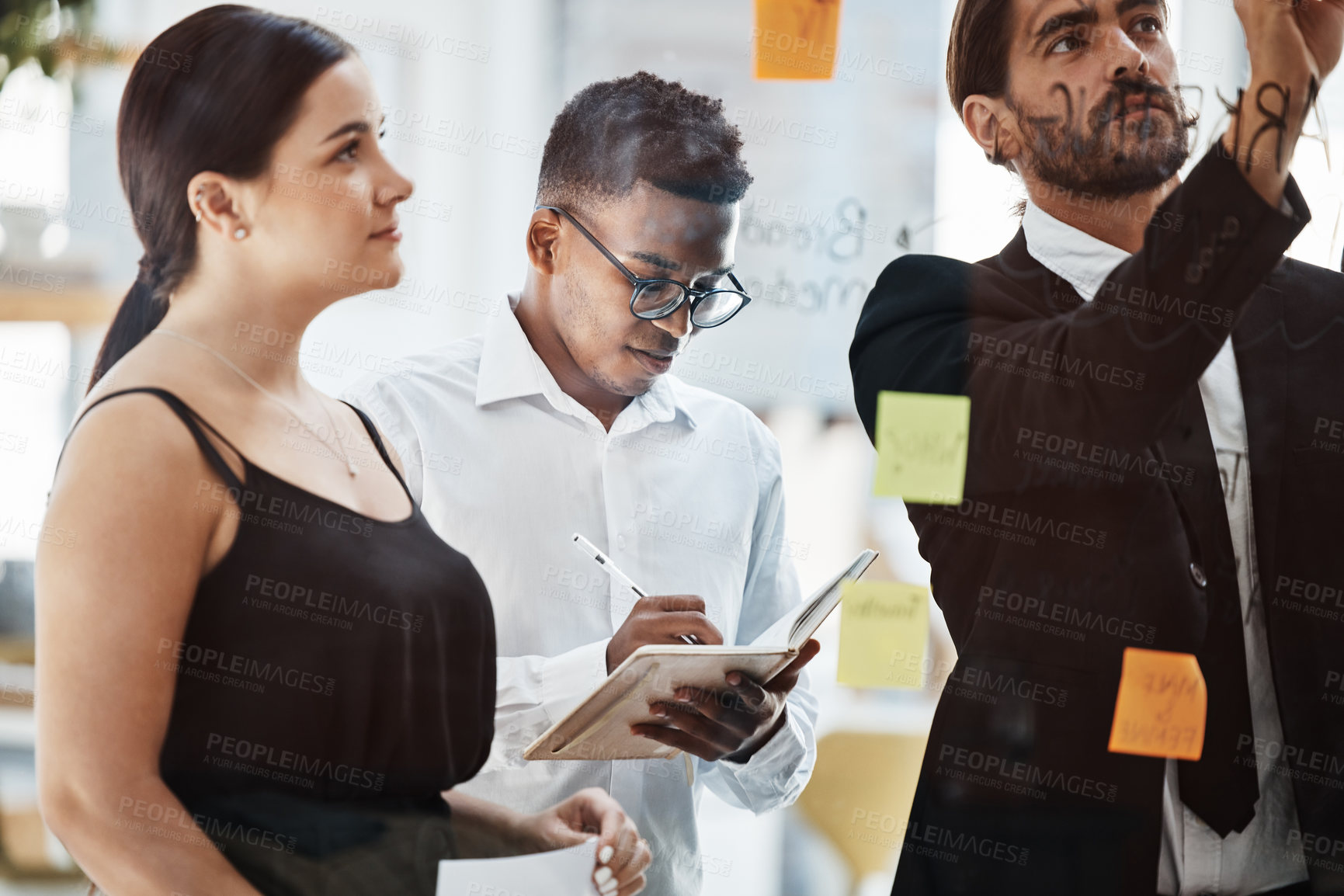 Buy stock photo Business people, planning and brainstorming by glass board at office meeting with woman, businessman and writing. Corporate group, sticky note and coaching for strategy, vision and financial goals