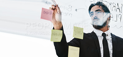 Buy stock photo Planning, brainstorming and businessman writing a schedule, idea and strategy on sticky note at work. Innovation, agenda and corporate employee with a goal, notes and ideas on a board for a solution