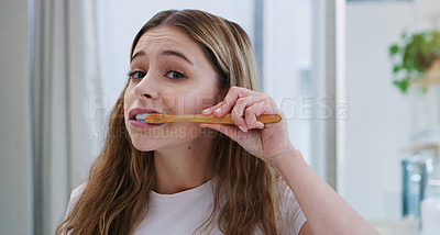 Buy stock photo Portrait, toothbrush and girl in bathroom for cleaning, hygiene and oral care in her home. Brushing teeth, face and female person in apartment for morning, routine or fresh, breath or mouth treatment
