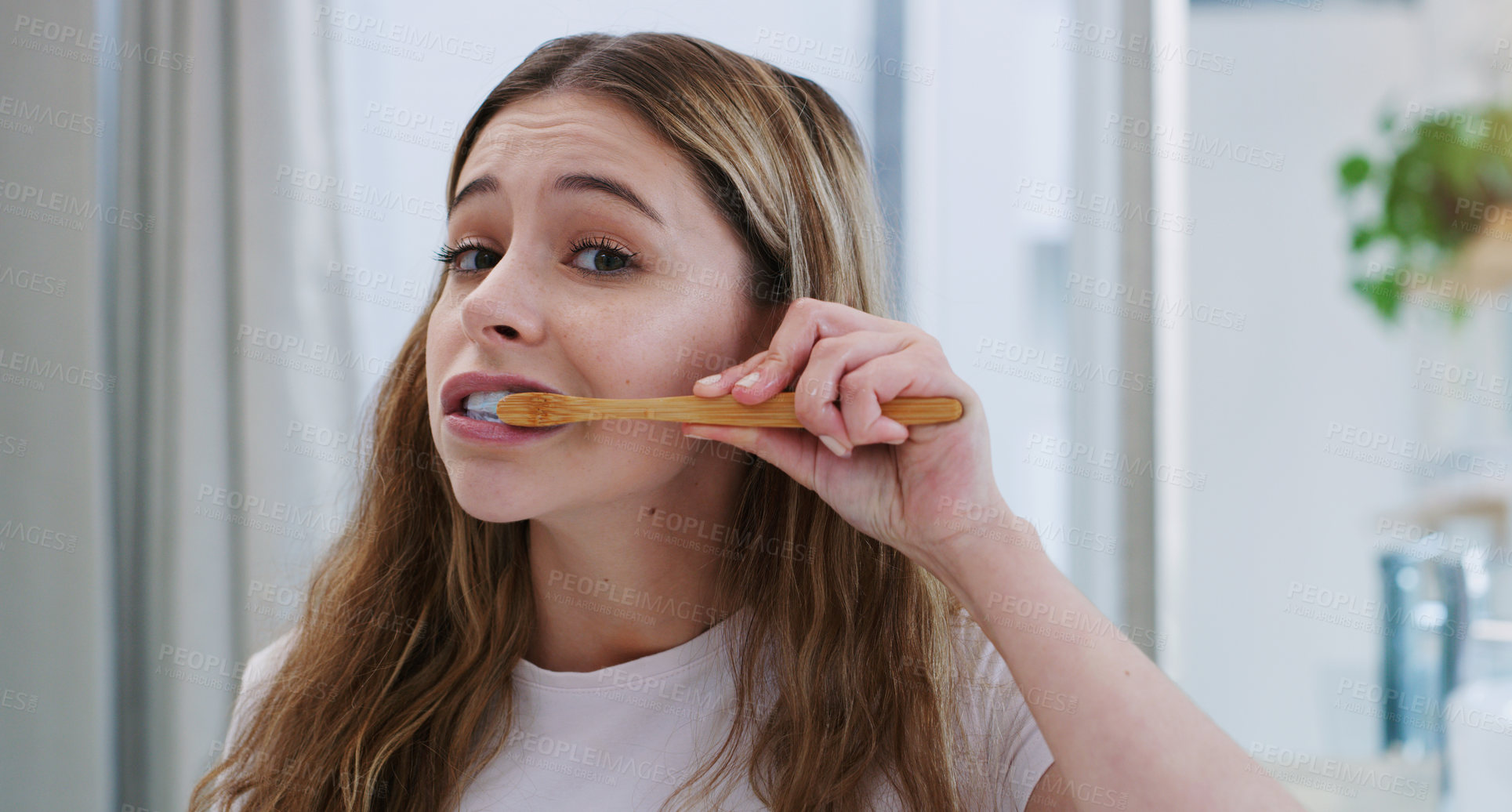 Buy stock photo Portrait, toothbrush and girl in bathroom for cleaning, hygiene and oral care in her home. Brushing teeth, face and female person in apartment for morning, routine or fresh, breath or mouth treatment