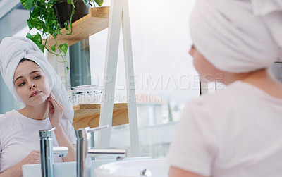 Buy stock photo Skincare, cotton and woman in mirror for cosmetic, beauty and skin wellness in bathroom. Face, cleaning and female person with facial pad for product application, dermatology or self care in her home
