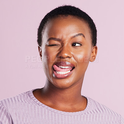 Buy stock photo Studio shot of a young woman making a silly face against a pink background