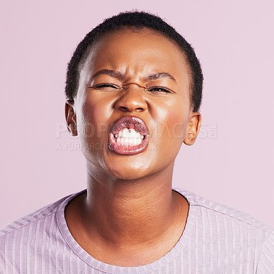 Buy stock photo African woman, mouth and funny face in closeup with squinting eyes isolated on pink background for joke or comedy. Female person or model and silly expression for goofy humor and emoji in studio