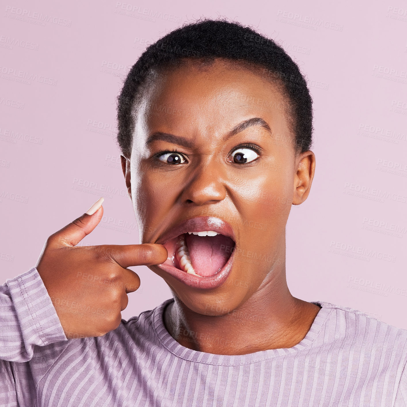 Buy stock photo Woman, squint and face in pink studio background with closeup in africa with meme. Female person, portrait and  squinting eyes for comedy expression with joy and goofy girl with weird or crazy look.