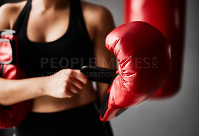 Buy stock photo Gloves, ready or hands of woman in boxing training, exercise or workout in gym studio for wellness. Boxer, sports athlete or fist of girl with safety gear, fitness or equipment on grey background