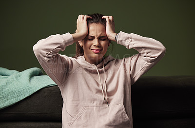 Buy stock photo Woman, frustrated and headache on sofa for mental health with anxiety, crying and depression from unemployment crisis. Pain, stress and tired gen z girl in apartment for burnout, fear and bad news