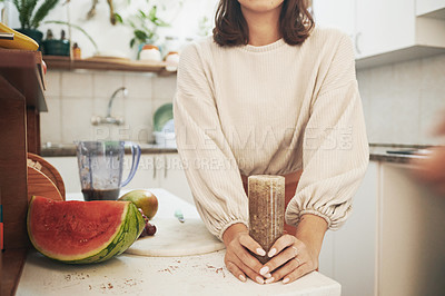 Buy stock photo Shot of an anonymous woman holding her smoothie glass