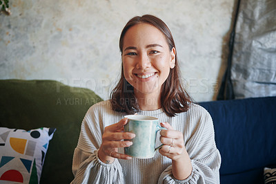 Buy stock photo Shot of a young woman enjoying a cup of coffee