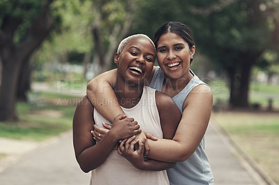 Buy stock photo Shot of two female friends taking a break during their workout