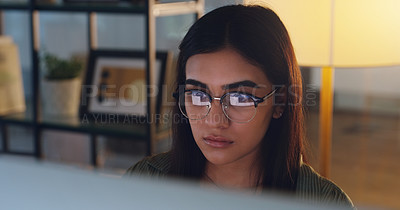 Buy stock photo Computer, night and face with a woman editor working in her office for a journalism or news report. Focus, editing and reporting with a young journalist at work on a desktop for online content
