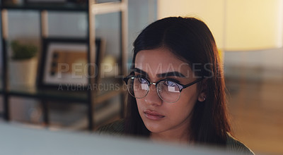 Buy stock photo Computer, night and face with a woman journalist working in her office for editing a news report. Focus, editing and reporting with a young female editor at work on a desktop for online content