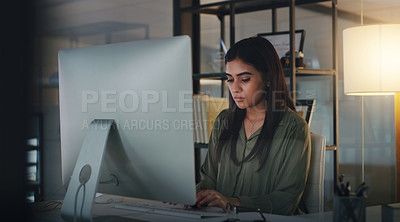 Buy stock photo Computer, night and typing with a woman editor working in her office for a journalism or news report. Focus, editing and reporting with a young journalist at work on a desktop for online content
