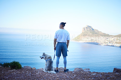 Buy stock photo Nature, lake and man with dog in mountain for hiking, walking and fresh air together outdoors. Traveling, friendship and back of male person with pet husky relax for freedom, adventure and exercise