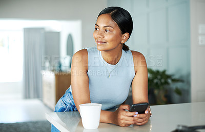 Buy stock photo Smile, coffee and woman with phone in kitchen networking on website, internet or mobile app. Technology, happy and female person typing online email on cellphone by counter in apartment in morning.