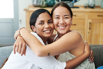 Buy stock photo Diversity, portrait and friends hugging on sofa in living room of home together for bonding or visit. Love, relax and smile with happy young women embracing in apartment for peace, support or trust